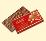 «ROSHEN» екстрамол. з ціл. ліс. горіхами, 26%, 100 г